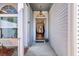 View of home entryway featuring sidelight windows and hanging pendant light at 106 Ranworth Ln, Summerville, SC 29485