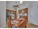 Bright kitchen with wood cabinets, stainless steel refrigerator, and cozy breakfast nook at 106 Ranworth Ln, Summerville, SC 29485
