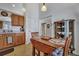 Small kitchenette area features wooden cabinetry and dining table with seating for four at 106 Ranworth Ln, Summerville, SC 29485