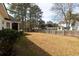Wide view of a fenced-in backyard with dry grass at 109 Presidio Bnd, Summerville, SC 29483