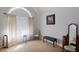 Bright bedroom with a large window, seating, and a decorative mirror and vanity at 109 Presidio Bnd, Summerville, SC 29483