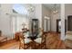 Inviting dining area showcasing wood floors, arch window, high ceilings and natural light at 109 Presidio Bnd, Summerville, SC 29483