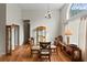 Dining area with tall arch window, wood floors and chandelier lighting at 109 Presidio Bnd, Summerville, SC 29483