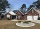 Charming one-story brick home featuring a two-car garage and manicured front yard at 109 Presidio Bnd, Summerville, SC 29483
