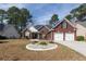 Charming brick home featuring a two-car garage, landscaped front yard, and inviting curb appeal at 109 Presidio Bnd, Summerville, SC 29483