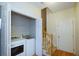 Laundry room with a washer and dryer next to a carpeted staircase at 109 Presidio Bnd, Summerville, SC 29483