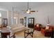 Spacious living room with a ceiling fan, elegant furnishings, and a view of the front entrance at 109 Presidio Bnd, Summerville, SC 29483