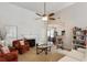 Cozy living room with a fireplace, comfortable seating, and an open view to the dining area at 109 Presidio Bnd, Summerville, SC 29483