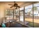 Bright sun room with ceiling fan and backyard views through large windows at 109 Presidio Bnd, Summerville, SC 29483