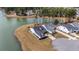 Stunning aerial view of a home on a point, surrounded by water and lush greenery at 115 Bluff Isle Ct, Summerville, SC 29486