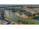 Aerial image showcasing a Primary-planned community with homes surrounding a beautiful lake system at 115 Bluff Isle Ct, Summerville, SC 29486