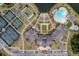 A sprawling community with tennis courts, pool, common buildings and manicured lawns and gardens, all seen from an aerial perspective at 115 Bluff Isle Ct, Summerville, SC 29486