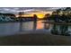 Aerial view of lake community reflecting a beautiful sunrise at 115 Bluff Isle Ct, Summerville, SC 29486