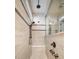 This walk-in shower features a tiled bench, large rainfall showerhead, and bronze fixtures at 115 Bluff Isle Ct, Summerville, SC 29486