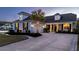 Charming home featuring a manicured lawn, mature palm tree, and inviting driveway at 115 Bluff Isle Ct, Summerville, SC 29486