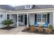 Inviting front porch with blue chairs, plants, and stylish columns at 115 Bluff Isle Ct, Summerville, SC 29486