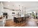 Spacious kitchen with white cabinets, granite countertops, stainless steel appliances, and an island with bar seating at 115 Bluff Isle Ct, Summerville, SC 29486