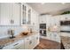Beautiful kitchen featuring white cabinetry, granite countertops, stainless steel appliances, and subway tile backsplash at 115 Bluff Isle Ct, Summerville, SC 29486