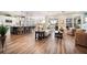 Open-concept living area with island kitchen, hardwood floors, and abundant natural light at 115 Bluff Isle Ct, Summerville, SC 29486