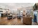 Open-concept living area with island kitchen, hardwood floors, and abundant natural light at 115 Bluff Isle Ct, Summerville, SC 29486