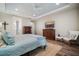 This spacious main bedroom features a light blue quilt, tray ceiling, and an entertainment center at 115 Bluff Isle Ct, Summerville, SC 29486
