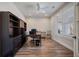 Office featuring built-in bookshelves, wood floors, and natural light from shuttered windows at 115 Bluff Isle Ct, Summerville, SC 29486