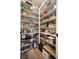 Walk-in pantry with ample shelving and storage, filled with food items and kitchen supplies for an organized kitchen at 115 Bluff Isle Ct, Summerville, SC 29486