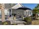 Charming outdoor patio featuring a dining area and comfortable seating, perfect for entertaining guests at 115 Bluff Isle Ct, Summerville, SC 29486