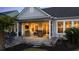 Cozy outdoor patio with comfortable seating, perfect for relaxing and enjoying the evening at 115 Bluff Isle Ct, Summerville, SC 29486