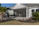 Inviting patio with a screened-in porch, perfect for enjoying the outdoors while staying protected from the elements at 115 Bluff Isle Ct, Summerville, SC 29486