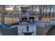 Cozy outdoor patio with a stone fireplace, perfect for relaxing with a glass of wine at 115 Bluff Isle Ct, Summerville, SC 29486