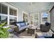 Relaxing porch with stylish furniture, an outdoor rug and tranquil view of the nearby lake at 115 Bluff Isle Ct, Summerville, SC 29486
