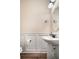 Powder room features wood floors, pedestal sink, and paneled wall at 115 Bluff Isle Ct, Summerville, SC 29486
