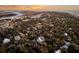 Expansive aerial view of a residential area with lush trees near the waterway at 129 Sparrow Dr, Isle of Palms, SC 29451