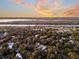 Scenic aerial view of a residential area with lush greenery and a waterway at 129 Sparrow Dr, Isle of Palms, SC 29451