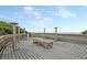 Inviting wooden deck area with showers and benches, offering convenient beach access with ocean views at 129 Sparrow Dr, Isle of Palms, SC 29451