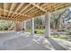Expansive covered patio featuring a concrete foundation, with backyard, a custom shower, and chairs at 129 Sparrow Dr, Isle of Palms, SC 29451