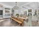 Elegant dining room with a long wooden table and cozy built-in seating at 129 Sparrow Dr, Isle of Palms, SC 29451