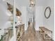 Bright and inviting entryway with hardwood floors, console table, decorative lighting and stylish accents at 129 Sparrow Dr, Isle of Palms, SC 29451