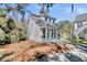 Charming exterior view of a two-story home with classic architectural details and a well-maintained yard at 129 Sparrow Dr, Isle of Palms, SC 29451