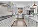 Contemporary kitchen featuring white cabinets, stainless steel appliances, and a sleek design at 129 Sparrow Dr, Isle of Palms, SC 29451