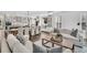 Open-concept living and dining area with hardwood floors and natural light at 129 Sparrow Dr, Isle of Palms, SC 29451