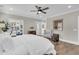 Bright main bedroom featuring hardwood flooring, an ensuite office, and neutral paint at 129 Sparrow Dr, Isle of Palms, SC 29451