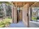 View of a custom outdoor shower with wood construction and a large open doorway to the backyard at 129 Sparrow Dr, Isle of Palms, SC 29451