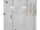 Modern shower with white subway tile surround, glass enclosure and premium fixtures at 129 Sparrow Dr, Isle of Palms, SC 29451