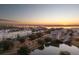 Picturesque sunset aerial view of waterfront homes and marshland; expansive bridge in the background at 145 Pier View St # 403, Charleston, SC 29492