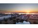 Aerial view of a waterfront community at sunrise with pond and bridge at 145 Pier View St # 403, Charleston, SC 29492
