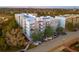 Beautiful new luxury apartment building with brick facade and balconies; well-manicured landscaping surrounds at 145 Pier View St # 403, Charleston, SC 29492