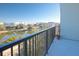 Relaxing balcony overlooking a serene waterfront with distant cityscape at 145 Pier View St # 403, Charleston, SC 29492