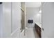 Bathroom with glass shower, granite double vanity and dark wood cabinets at 145 Pier View St # 403, Charleston, SC 29492